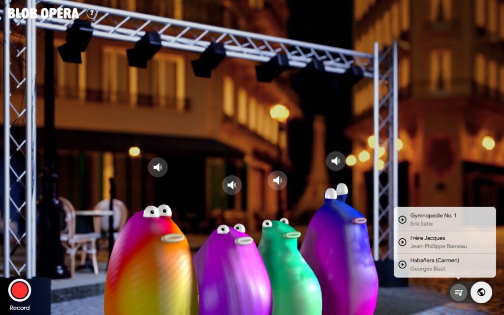 Blob Opera Paris stage on a lamplit street with cafe chairs and the Paris song list